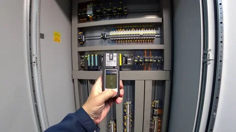 Engineer checks the gas level of the personal gas analyzer Drager at his workpla Stock Footage 79053852