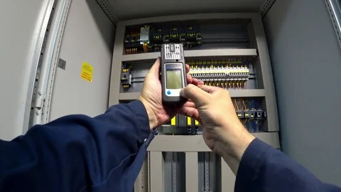 Engineer checks the gas level of the personal gas analyzer Drager at his workpla Stock Footage 79053990