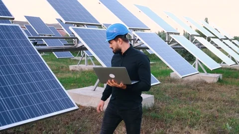 The engineer checks the productivity of the solar panels. Photovoltaic panel Video stock 140002426