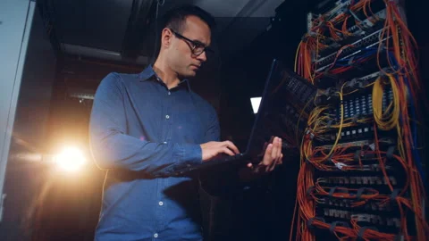An engineer checks server computer at a data center, close up. Stock Footage 98580116