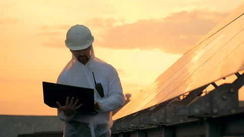 Engineer checks solar panels, working with a laptop, close up. Stock Footage 100974914