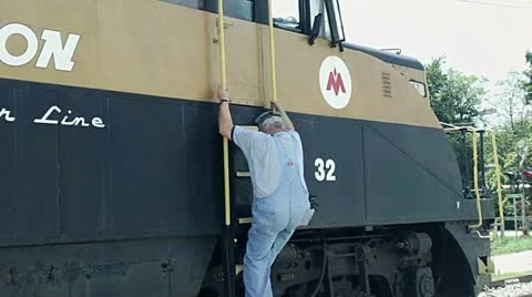 Engineer Climbs Down Railroad Engine Stock Footage 11490934