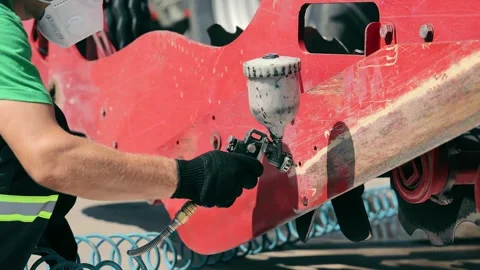 The engineer Close up paints the elements of the housing of agricultural Stock Footage 252284519