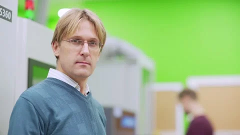 Engineer closing laptop and posing in factory lab Stock Footage 142162257