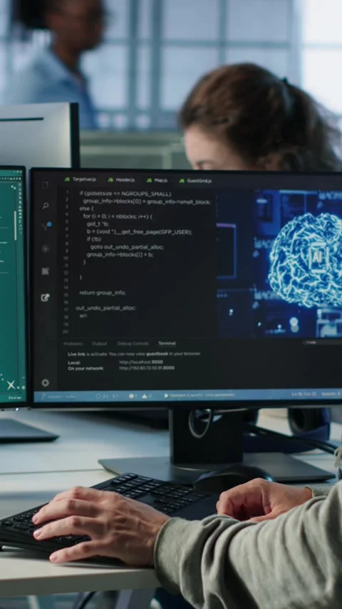Engineer coding AI virtual assistant producing clips Stock Footage 319559295