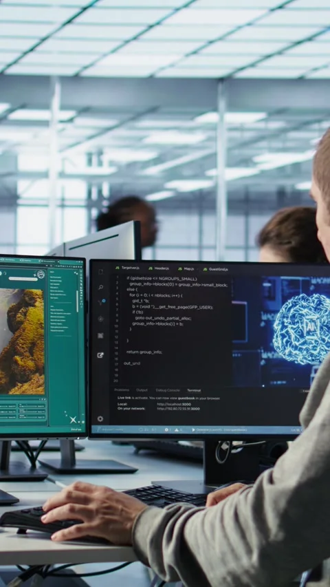 Engineer coding AI virtual assistant producing clips Stock Footage 319565730