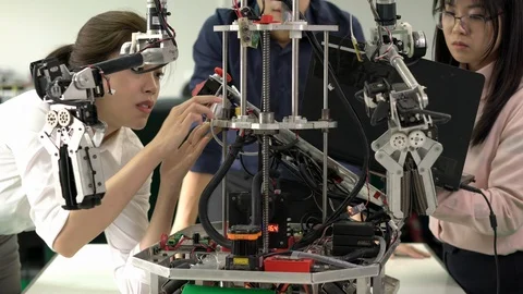 Engineer collaborating development robot in modern laboratory. Stock Footage 113703459