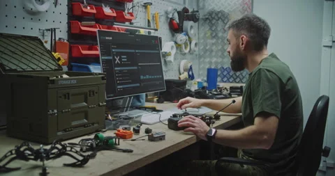Engineer Combining Software Design With Physical Drone Assembly Stock Footage 322099542