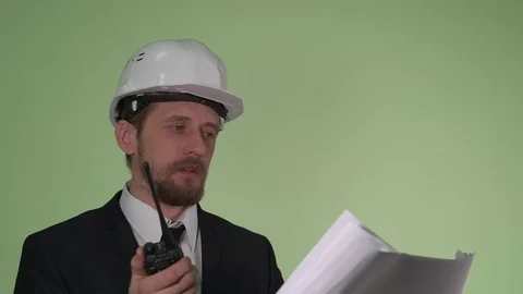 Engineer communicates by radio with the team Stock Footage 70697857
