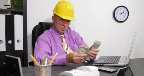 Engineer in Company Office with Cash in Hand Calculate Income and Payments Stock Footage 103259953