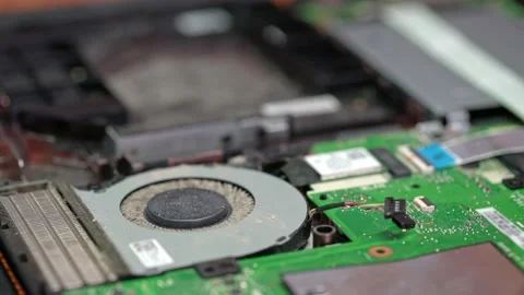 An engineer is a computer repair technician, unscrews a bolt and removes the Video stock 131059166