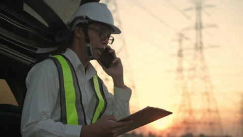 Engineer concept of 4k Resolution. Asian men are coordinating using mobile ph Stock Footage 154119831