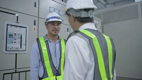 Engineer concept of 4k Resolution. A colleague shaking hands inside the offic Stock Footage 147989104