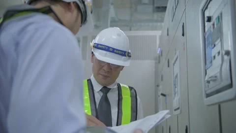 Engineer concept of 4k Resolution. The employee is checking the generator. Stock Footage 154315976