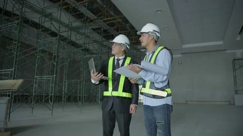 Engineer concept. Business people plan construction work in the building. 4k  Stock Footage 141823346