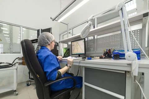 The engineer conducts a test of the finished electronic modules. Laboratory for Stock Photos