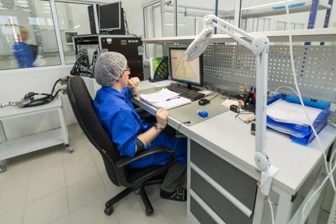 The engineer conducts a test of the finished electronic modules. Laboratory for Stock Photos