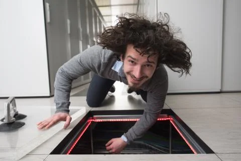 Engineer connecting cables in server room Stock Photos