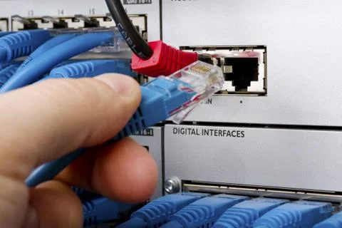 Engineer connecting telecom cable Stock Photos