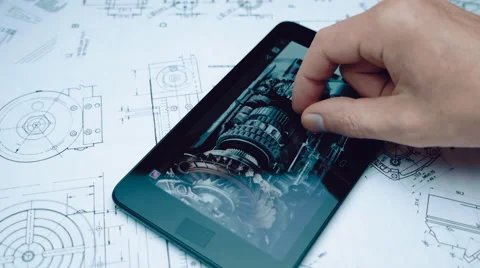 Engineer considers the image of a mechanical device on the screen of the tablet Stock Footage 56266321