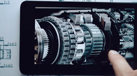 Engineer considers the image of a mechanical device on the screen of the tablet Stock Footage 56267824