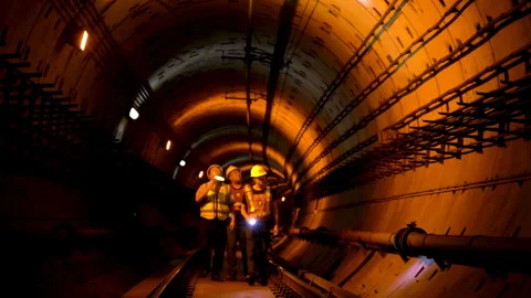Engineer construction maintenance worker in safety vest, hard hats inspect Stock Footage 347671114