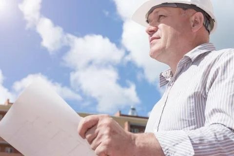 An engineer with construction plans Stock Photos