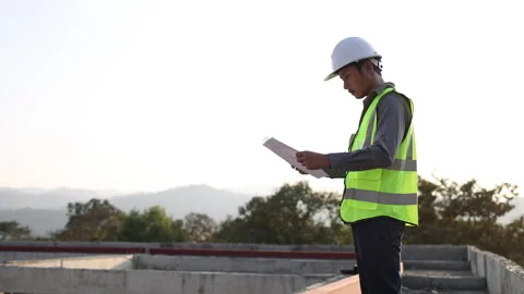 Engineer At the construction site, engineers check the correctness of build.. Stock Footage 336939159