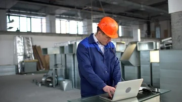 Engineer, Construction supervisor, builder, worket using laptop at a Stock Footage 85813640