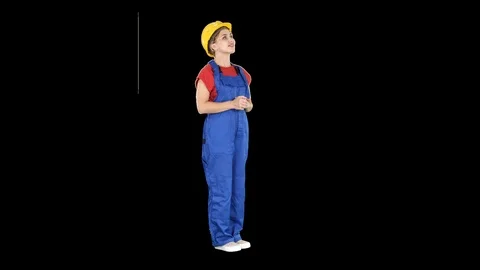 Engineer construction worker woman looking up at a building or statistics or Vídeos de archivo 103833625