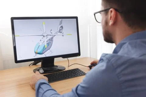 Engineer, Constructor, Designer in Glasses Working on a Personal Computer. He Stock Photos