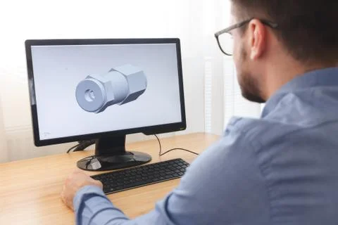 Engineer, Constructor, Designer in Glasses Working on a Personal Computer. He Stock Photos