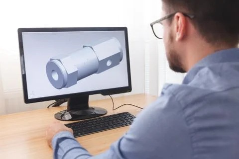 Engineer, Constructor, Designer in Glasses Working on a Personal Computer. He Stock Photos