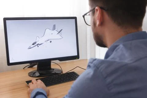 Engineer, Constructor, Designer in Glasses Working on a Personal Computer. He Stock Photos