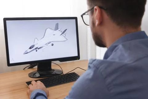 Engineer, Constructor, Designer in Glasses Working on a Personal Computer. He Stock Photos