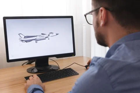 Engineer, Constructor, Designer in Glasses Working on a Personal Computer. He Stock Photos