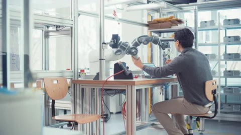 Engineer Control Robotic Arm With Control Panel Stock Footage 187572459