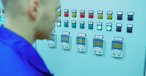Engineer in the control room / looks at the measuring instruments in the control Stock Footage 82937896