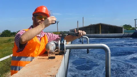 An engineer controlling a quality of water Stock Footage 125080854