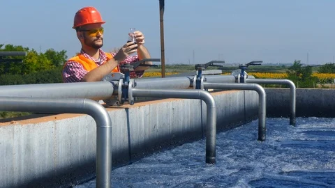 An engineer controlling a quality of water Stock Footage 125080968
