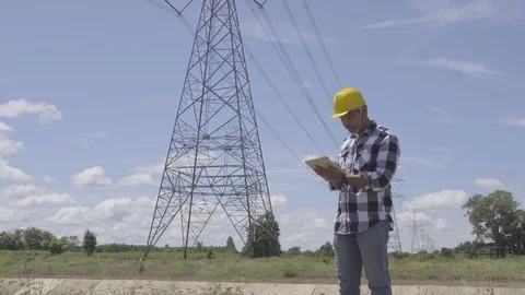 Engineer is controlling a tablet smart computer using the construction Stock Footage 117073804