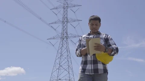 Engineer is controlling a tablet smart computer using the construction Stock Footage 117074452