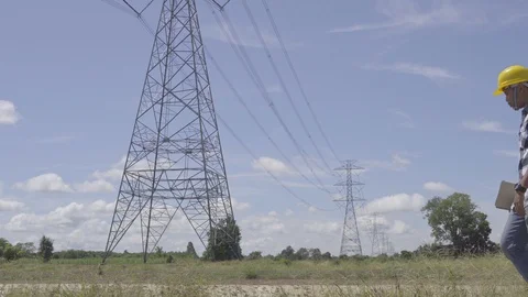 Engineer is controlling a tablet smart computer using the construction Stock Footage 117074716