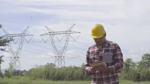 Engineer is controlling a tablet smart computer using the construction Stock Footage 117081405