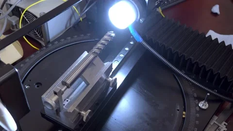 Engineer Controls Detail Quality under Microscope. Quality control of drill Stock Footage 171776474