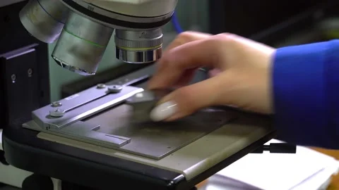 Engineer Controls Detail Quality under Microscope. Quality control of drill Stock Footage 171776980