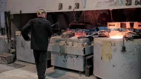 The engineer controls the operation of furnaces for melting metal. Heat Stock Footage 172014899