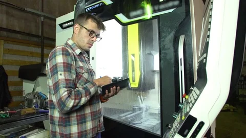 Engineer controls the operation of the milling machine 4k. Stock Footage 77827088
