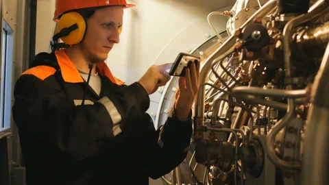 The engineer controls the turbine Stock Footage 85843069