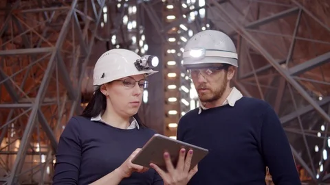 Engineer couple And Client Looking On Project On The Construction Site using  Video stock 107254644